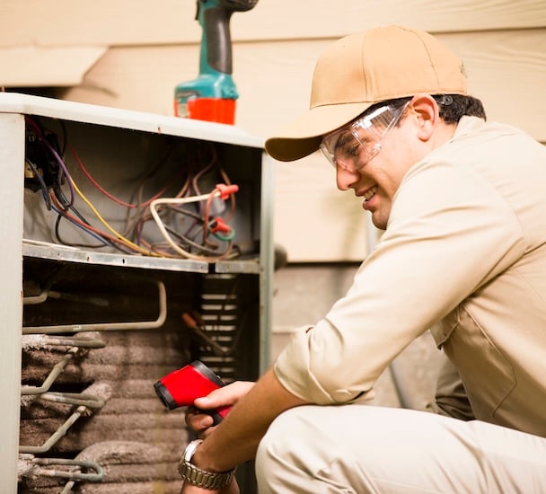 AC repair technician outside austin texas home fixing hvac unit